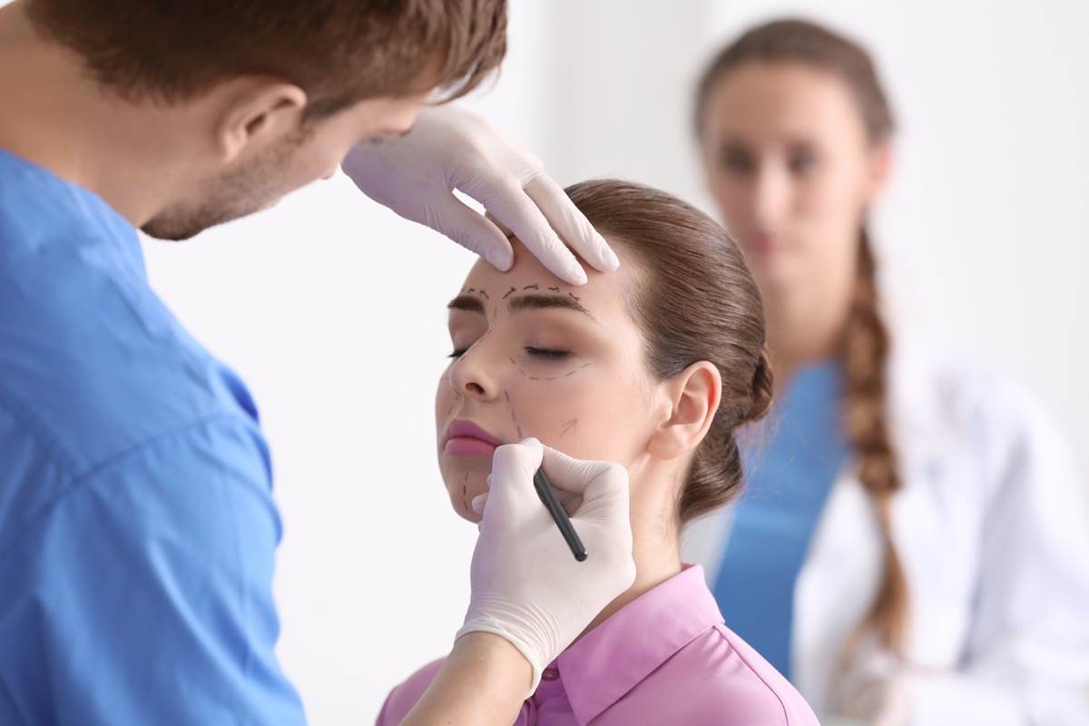 plastic surgery marks being made on woman by doctor, pageant facts