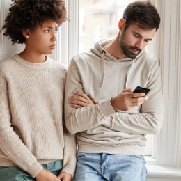 young attractive woman wonders why young attractive man would rather play with his phone than have sex with her, how to break up with someone, how to break up with someone