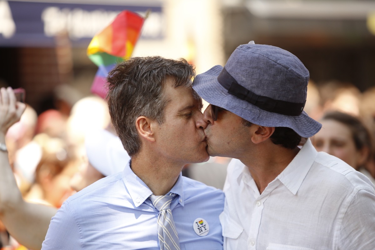 state senator brad hoylman and husband kiss at new york city pride parade photos from pride celebrations