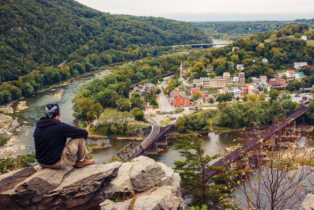 sad millennial gazing upon beautiful town in West Virginia