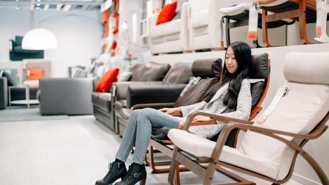 woman at furniture store sitting in seat