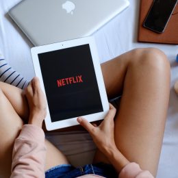 woman with iPad watching netflix