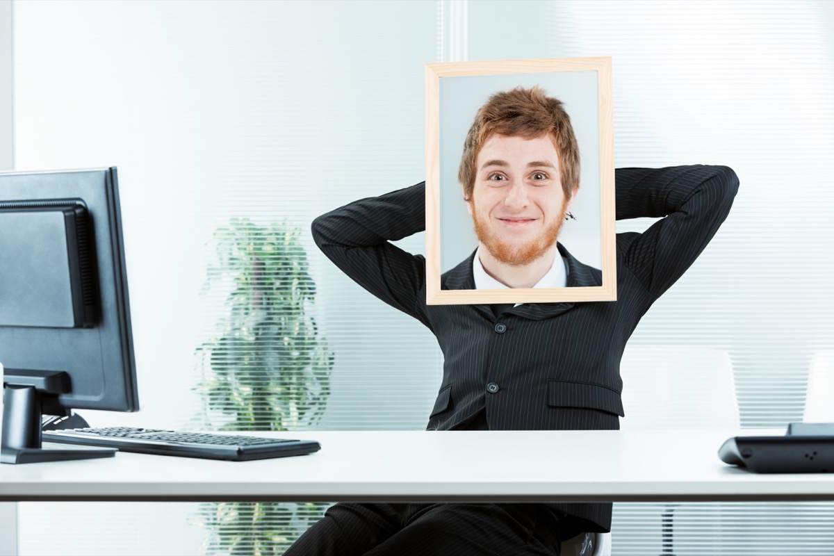 Worker with Portrait Over His Face Funny Stock Photos