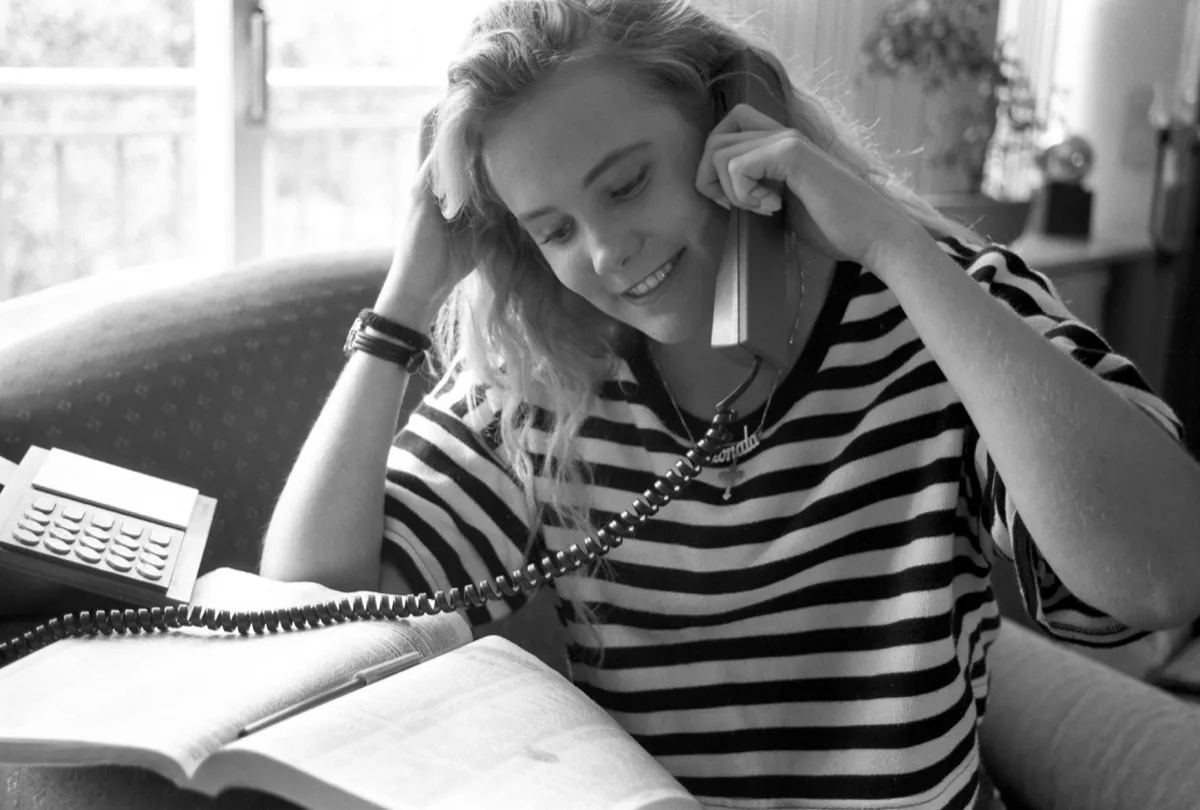 1980s photo of a woman calling someone to ask out, 1980s nostalgia