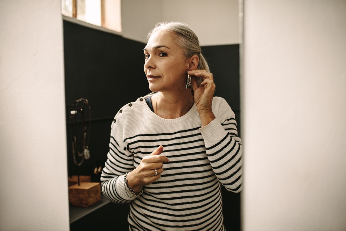 Older Woman with white hair wears earrings, diy hacks
