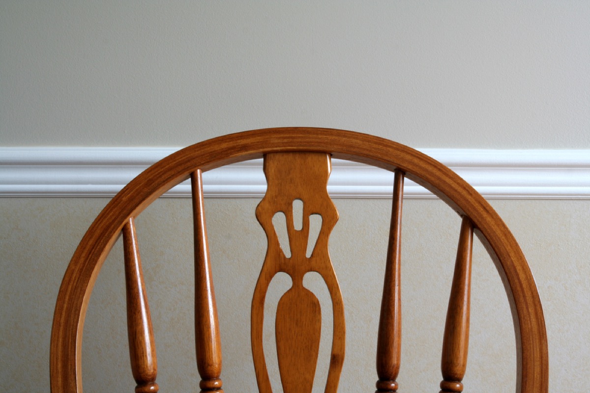 wooden chair against chair rail molding, vintage home upgrades