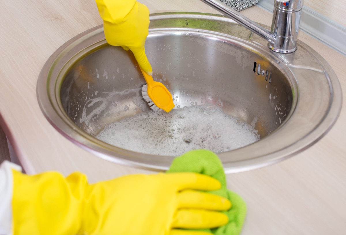Person Cleaning the Kitchen Sink Dirtiest Things in Your Home