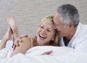 couple laughing in bed, age sex is best
