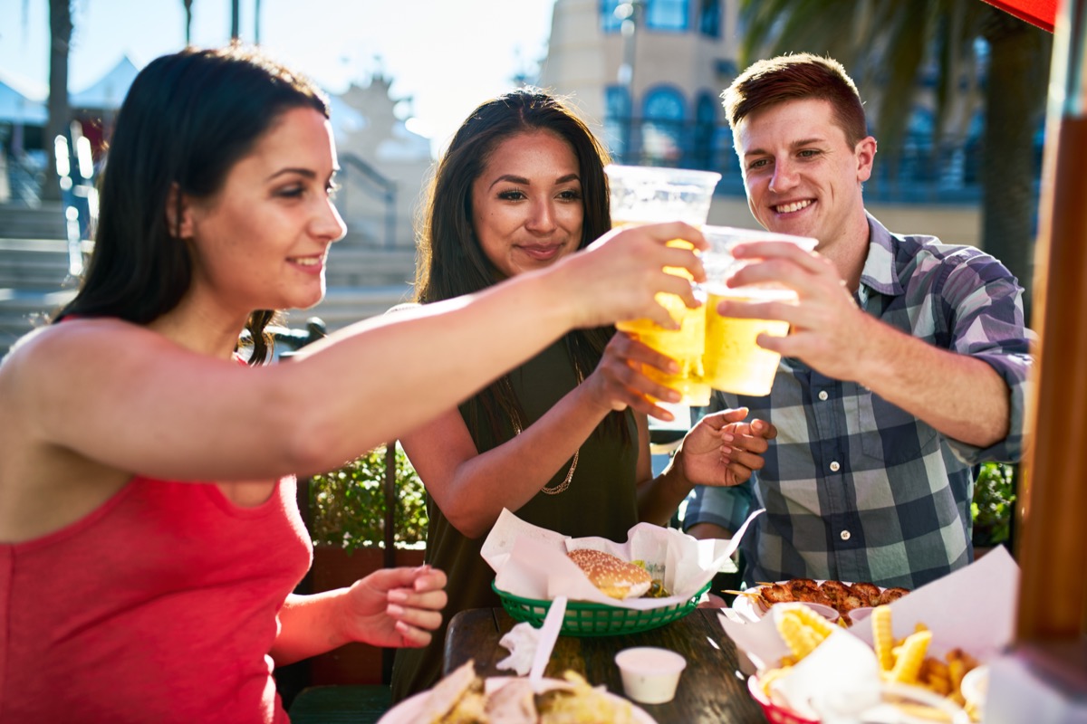 Friends Drinking Beers Outdoors BBQ Etiquette Mistakes
