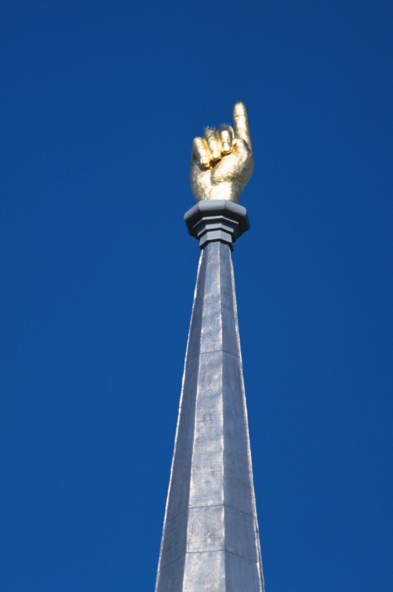 gold hand pointing towards the sky, weird state landmarks