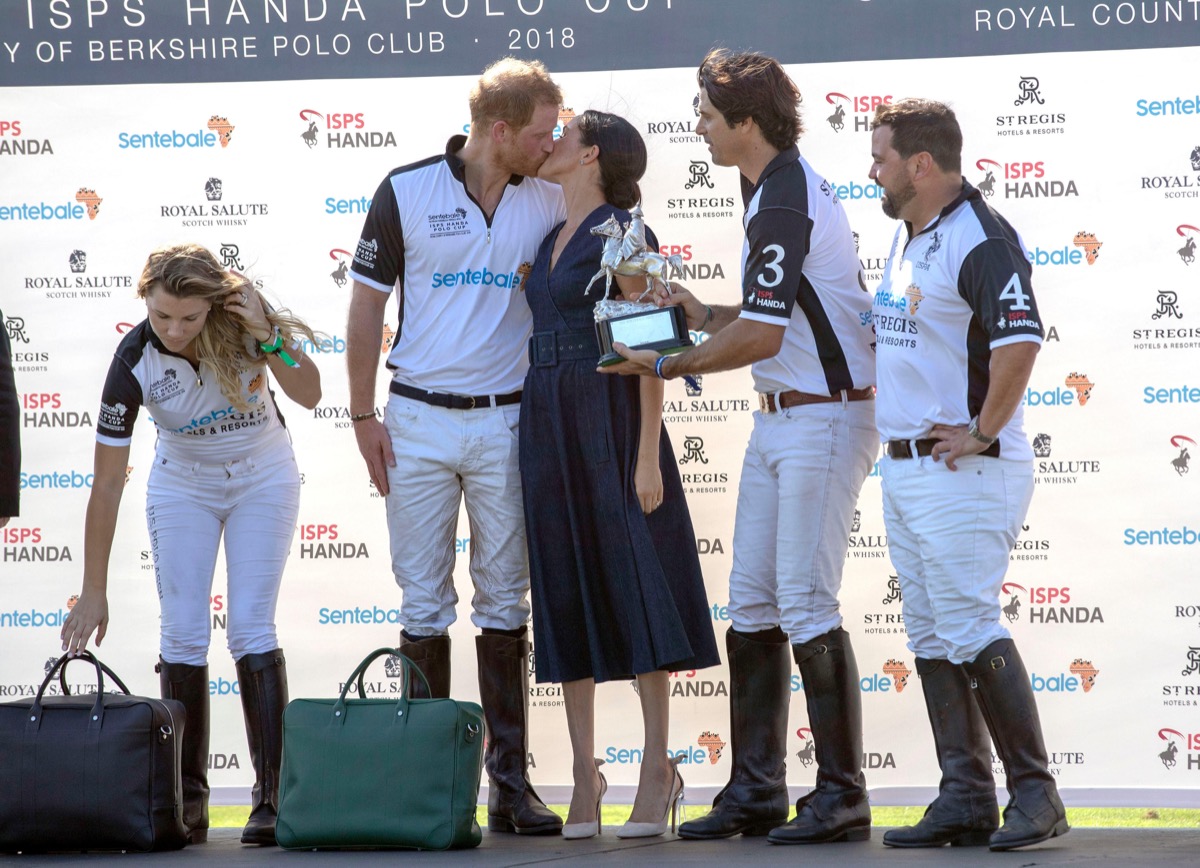 The Duke and Duchess of Sussex have a kiss at the Sentebale ISPS Handa Polo Cup at the Royal County of Berkshire Polo Club in Windsor.