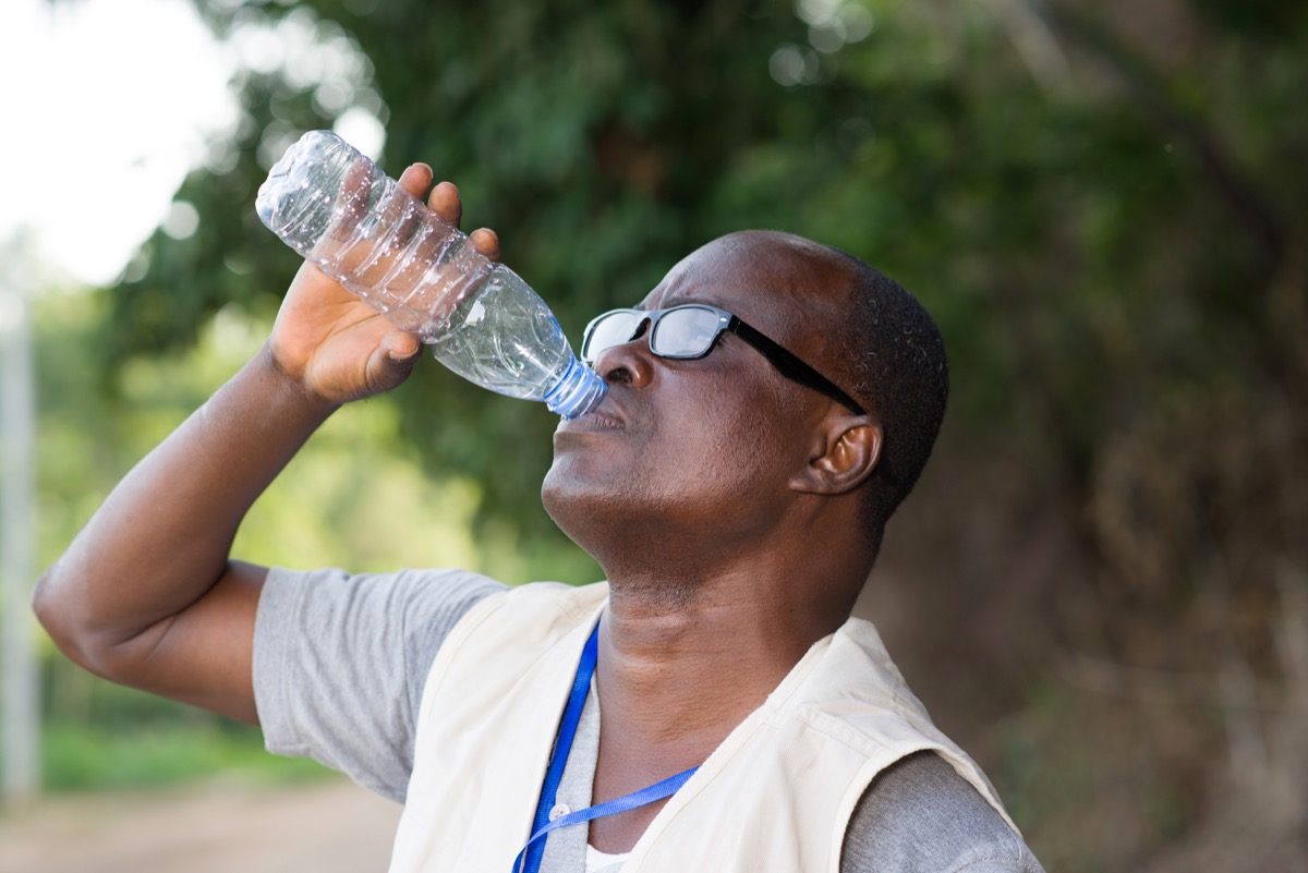 man drinking water after exercising, healthier man after 40
