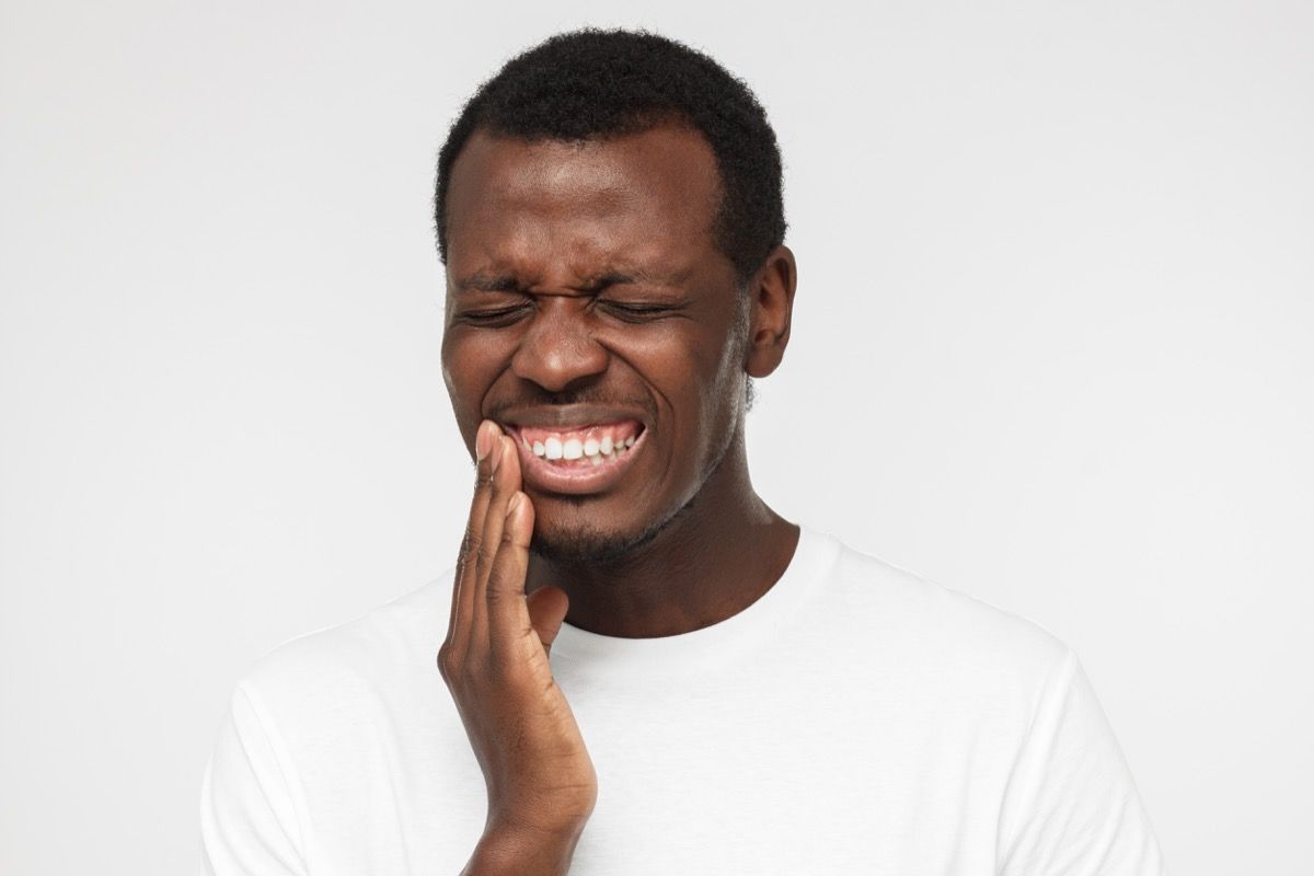 man with jaw pain, heart warning signs