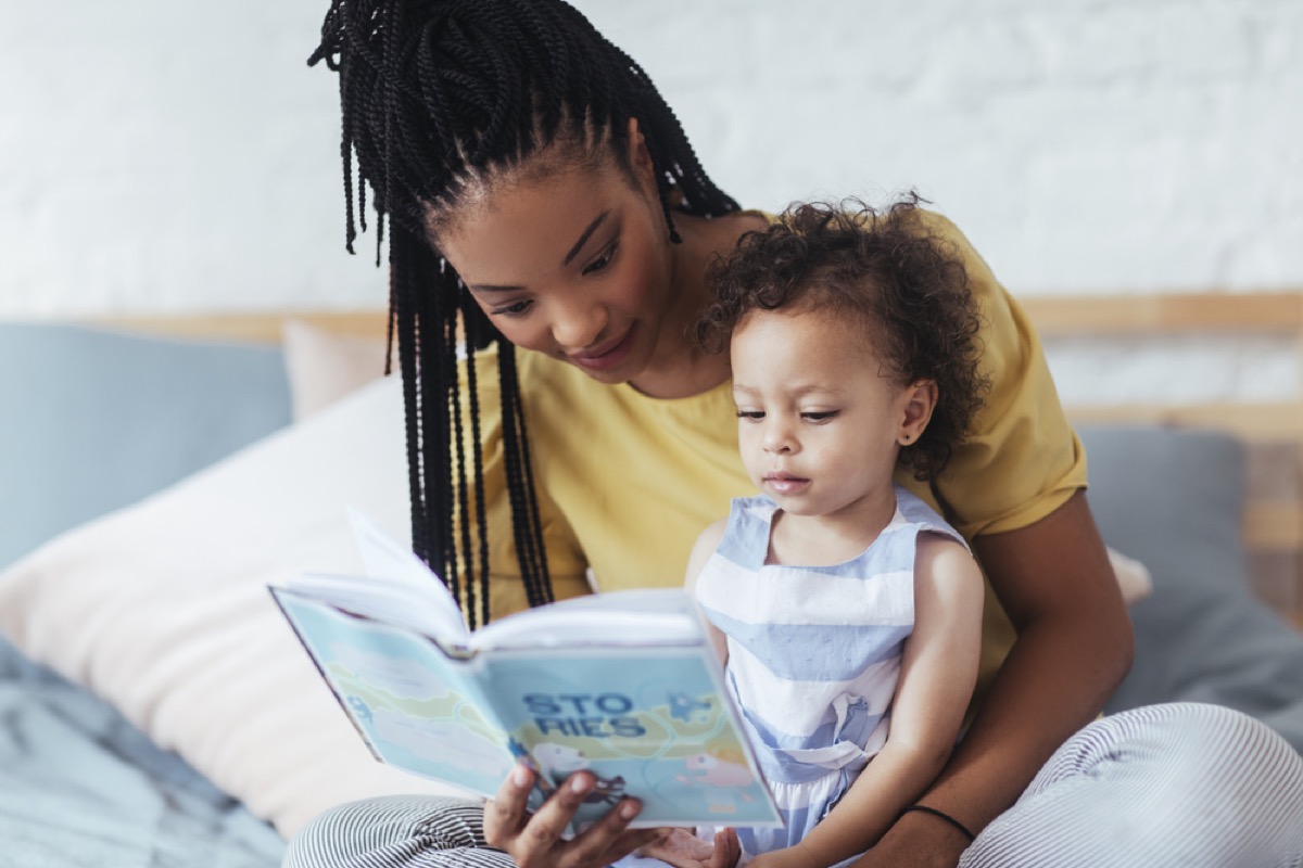 woman reading to child, parenting tips