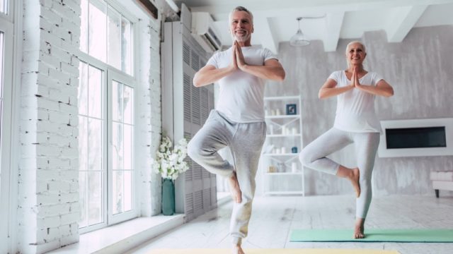 older couple in tree pose, better wife after 40