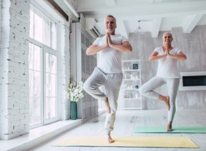 older couple in tree pose, better wife after 40