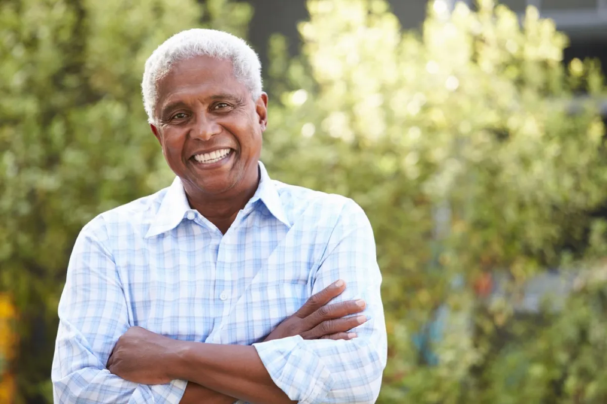 older black man standing outdoors, look better after 40