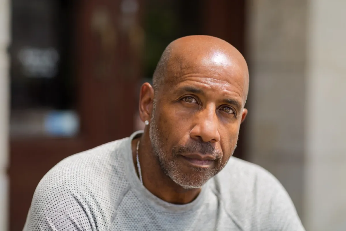 older black man with light stubble outdoors, look better after 40