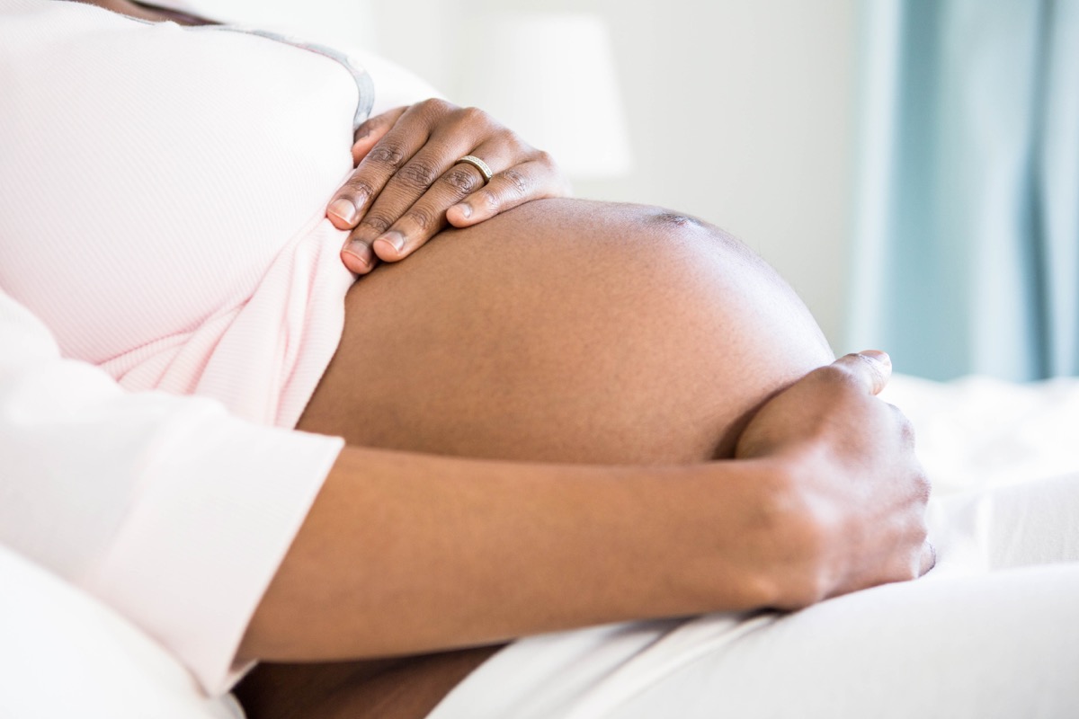 A Pregnant Black Woman Touching Her Baby Belly, heart risk factors