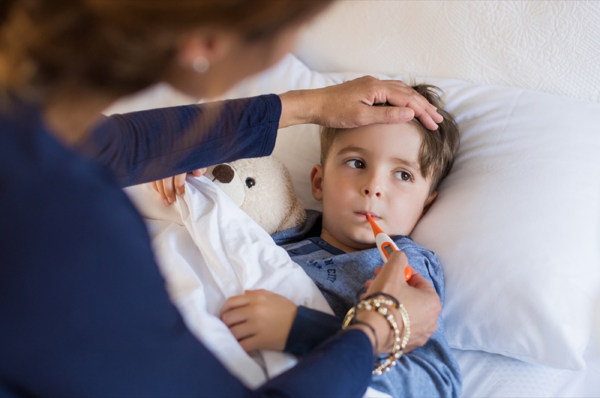 mom taking boy's temperature, parenting myths