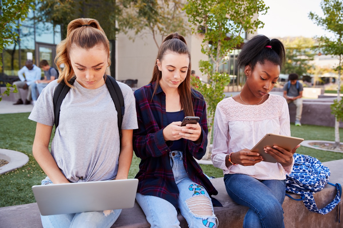A Group of Teenage Girls Using Their Electronic Devices How Parenting Has Changed