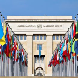 flags outside of the united nations building in geneva switzerland