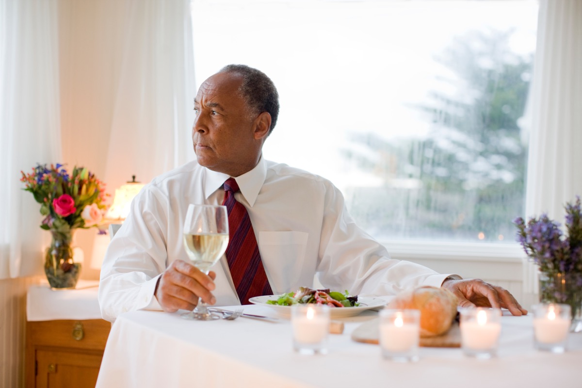Man drinking wine with dinner