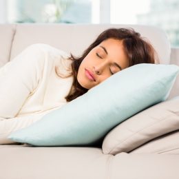 woman napping on couch