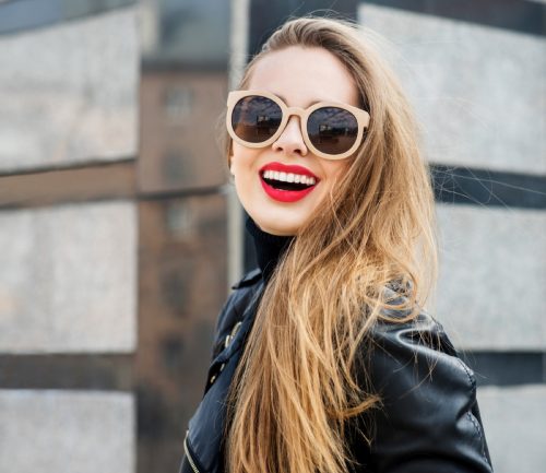 woman standing outside with red lipstick and sunglasses, make yourself more attractive