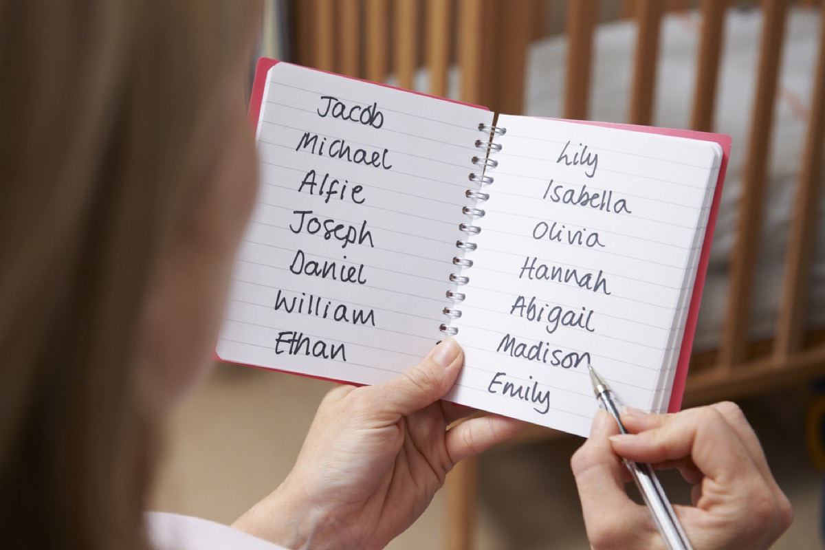 woman writing down a list of baby names, how parenting has changed