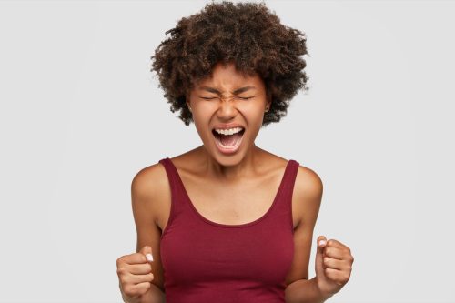 woman yelling into the air, ways to feel amazing