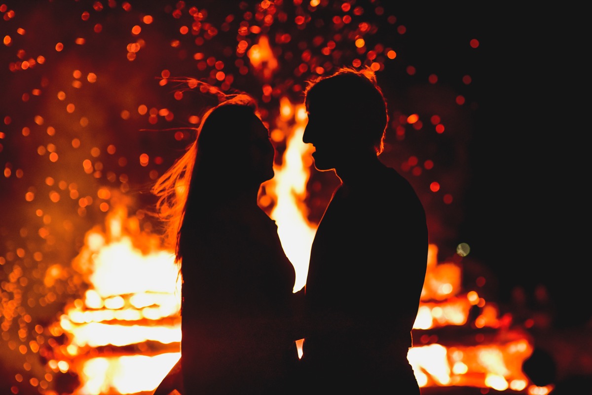 Couple in front of fire, craziest things brides and grooms have ever done at weddings