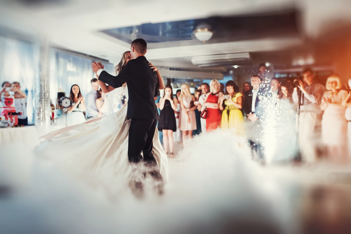 Couple dances in backdrop of smoky dance floor, craziest things brides and grooms have ever done at weddings