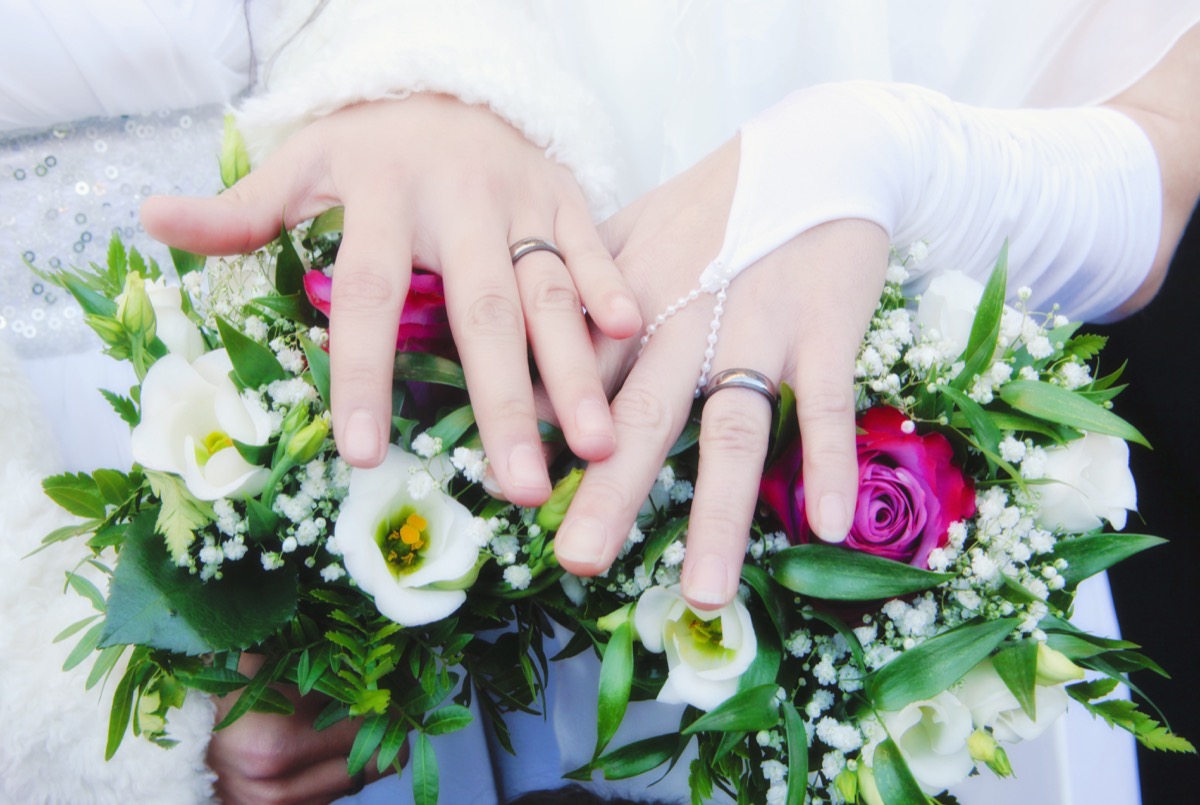 lesbian couple shows wedding bands, craziest things brides and grooms have ever done at weddings