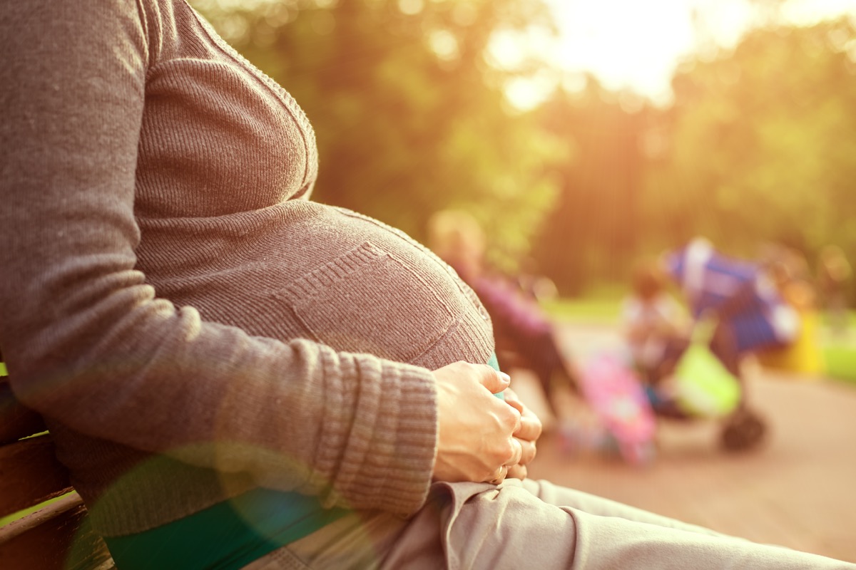 Pregnant Woman on Park Bench