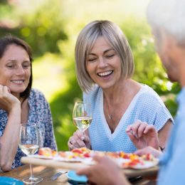 women look at food at party offered by male host, healthy sex after 40