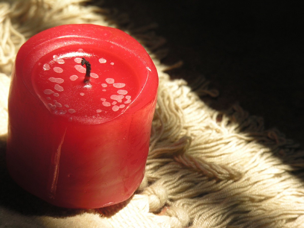 red candle on shag carpet, things you shouldn't store in your basement