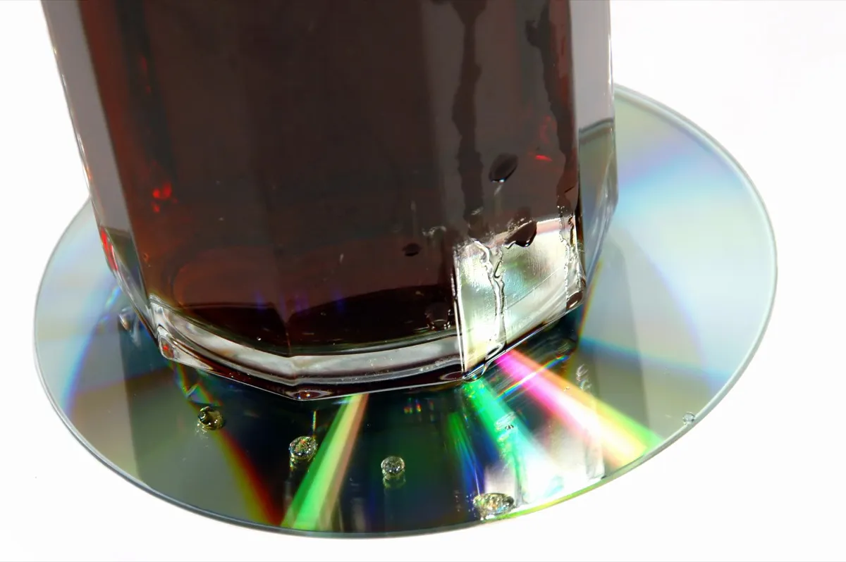 An Old CD Being Used as a Coaster Reuse Disposable Items