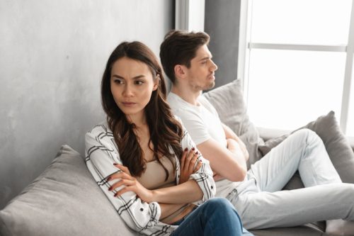 couple fighting in living room, things you should never say to your spouse