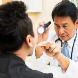 Doctor Examining a Patient's Mouth Tongue Health