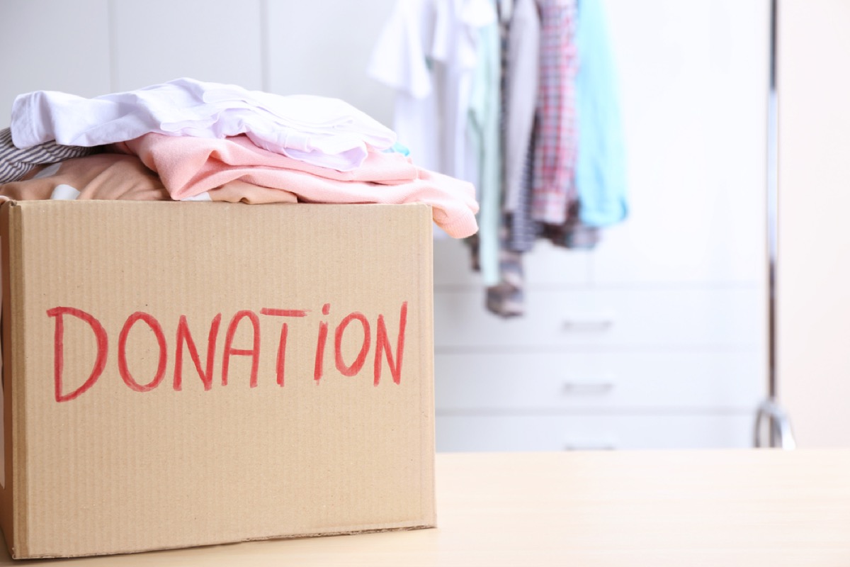 clothing in donation box, downsizing your home
