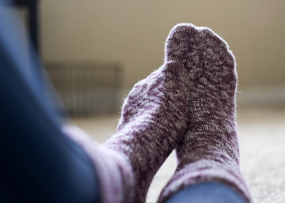 Woman Wearing Fuzzy Socks Aching Feet