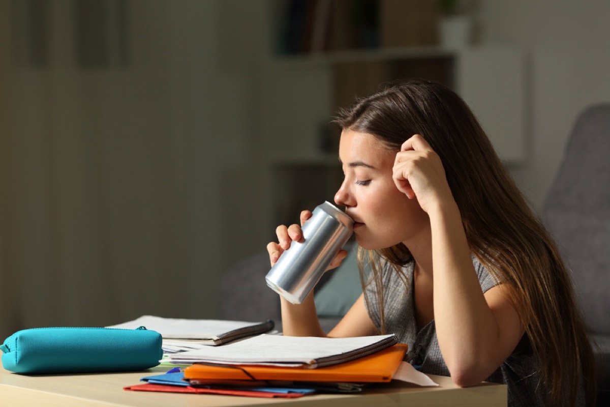 teen drinking out of a can while studying, bad parenting