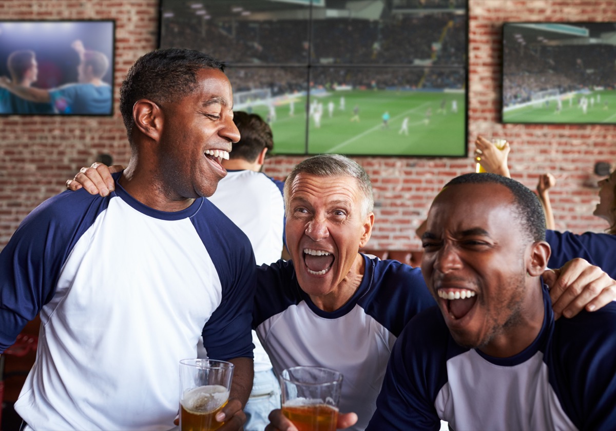middle-aged men in a sports bar