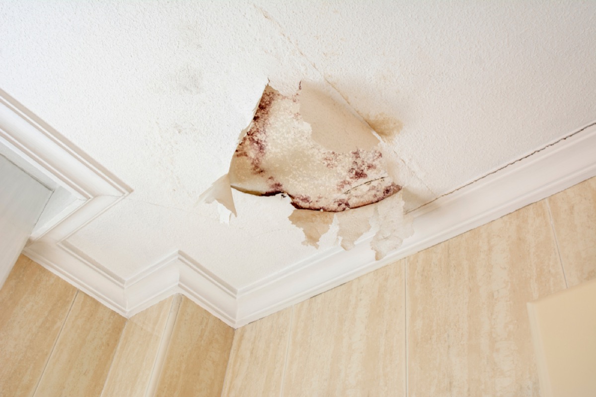 plaster ceiling with cracked paint and mold stains, signs you need a new mattress