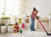 woman and child vacuuming floor and cleaning living room, vacuuming tips
