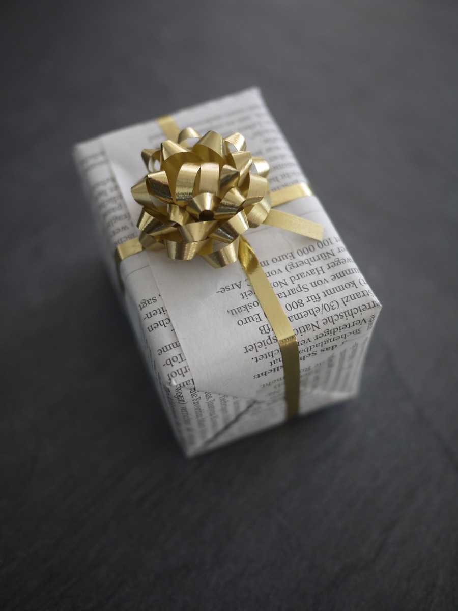 A Present Wrapped in Newspaper Reuse Disposable Items