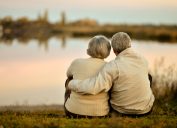 happy elderly couple gazing at sunset, healthy sex after 40
