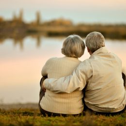 happy elderly couple gazing at sunset, healthy sex after 40