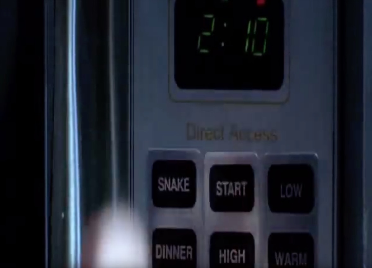 a microwave with a button for snakes